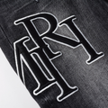 Amr Staggered Black Jeans
